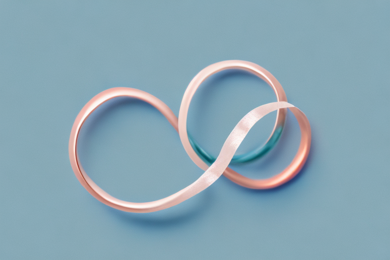 A pair of wedding rings entwined with a soft